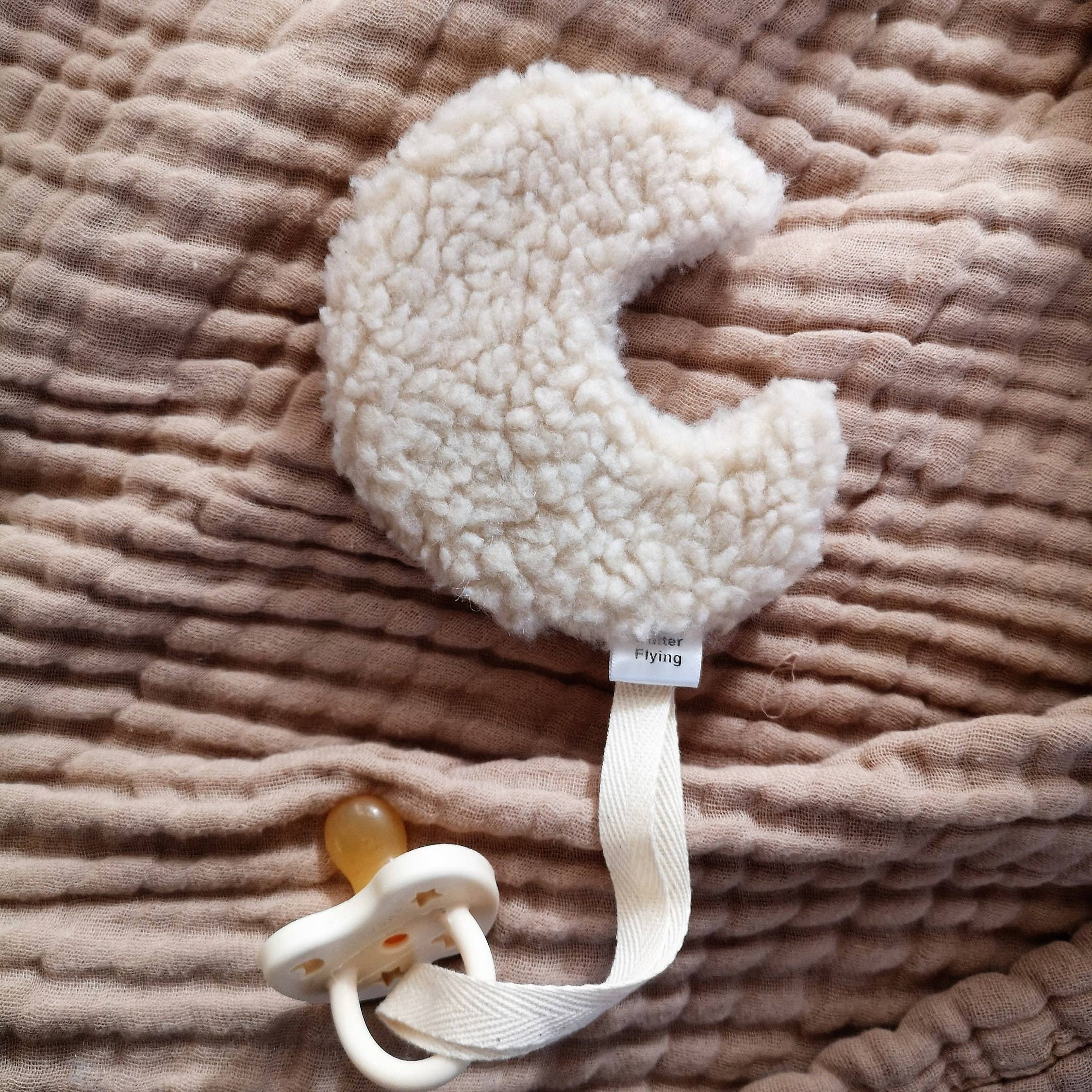 Moon-shaped pacifier clip