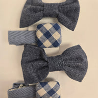Set of denim and checkered hair bows on a light background
